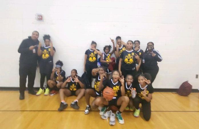 girls basketball team posing